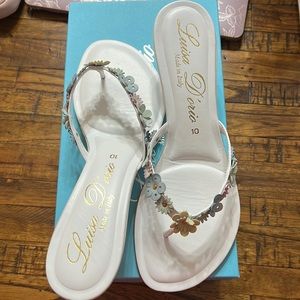 Women’s size 10 white/multi color kitten heels. New in box!